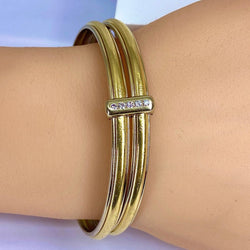 Bracelets Joncs YVES SAINT LAURENT en or blanc, or jaune et diamants - Castafiore