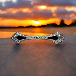 Broche barrette Art - Déco en platine, diamants et onyx. - Castafiore