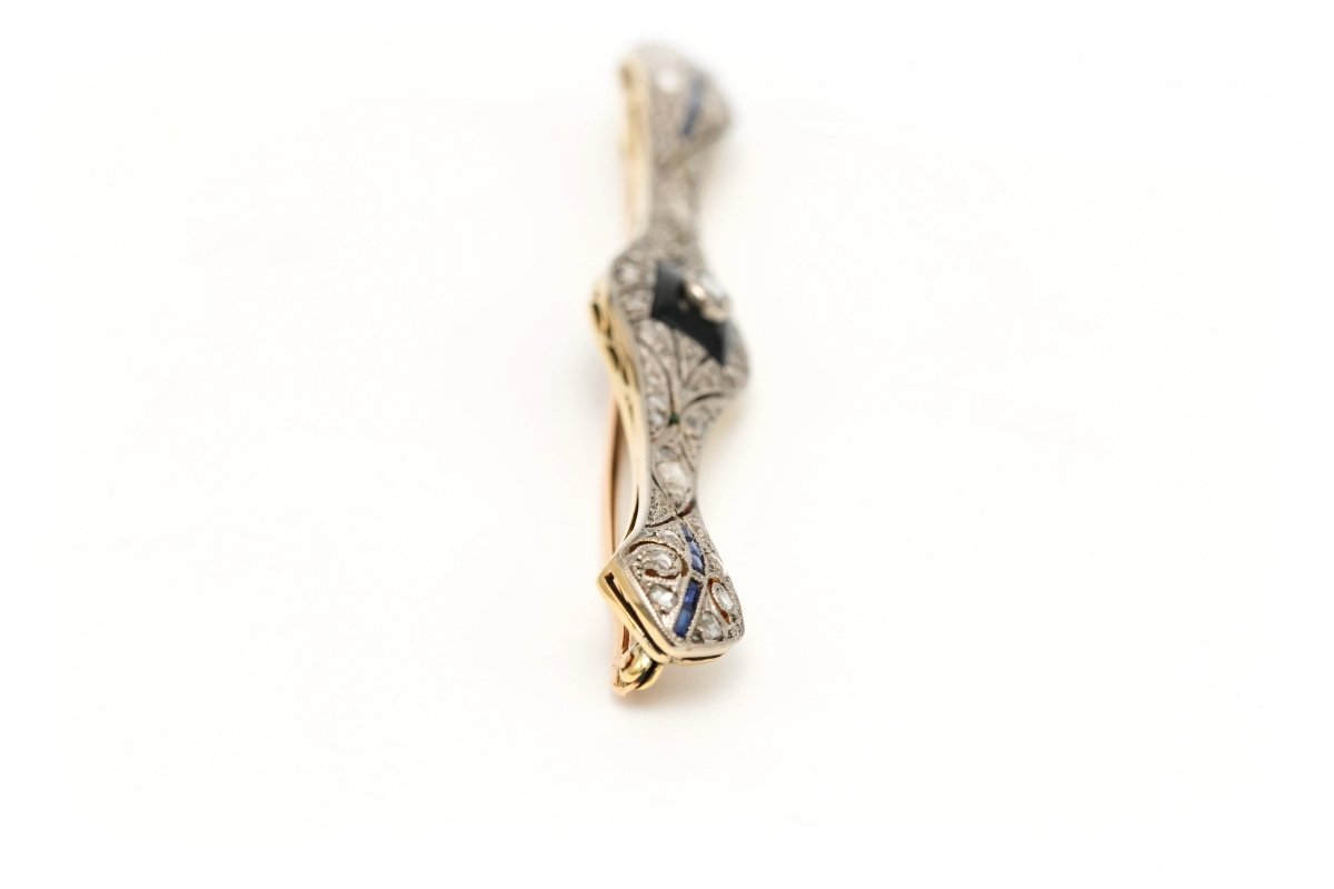 Broche Barrette en or blanc, or jaune, onyx, saphirs et diamants - Castafiore