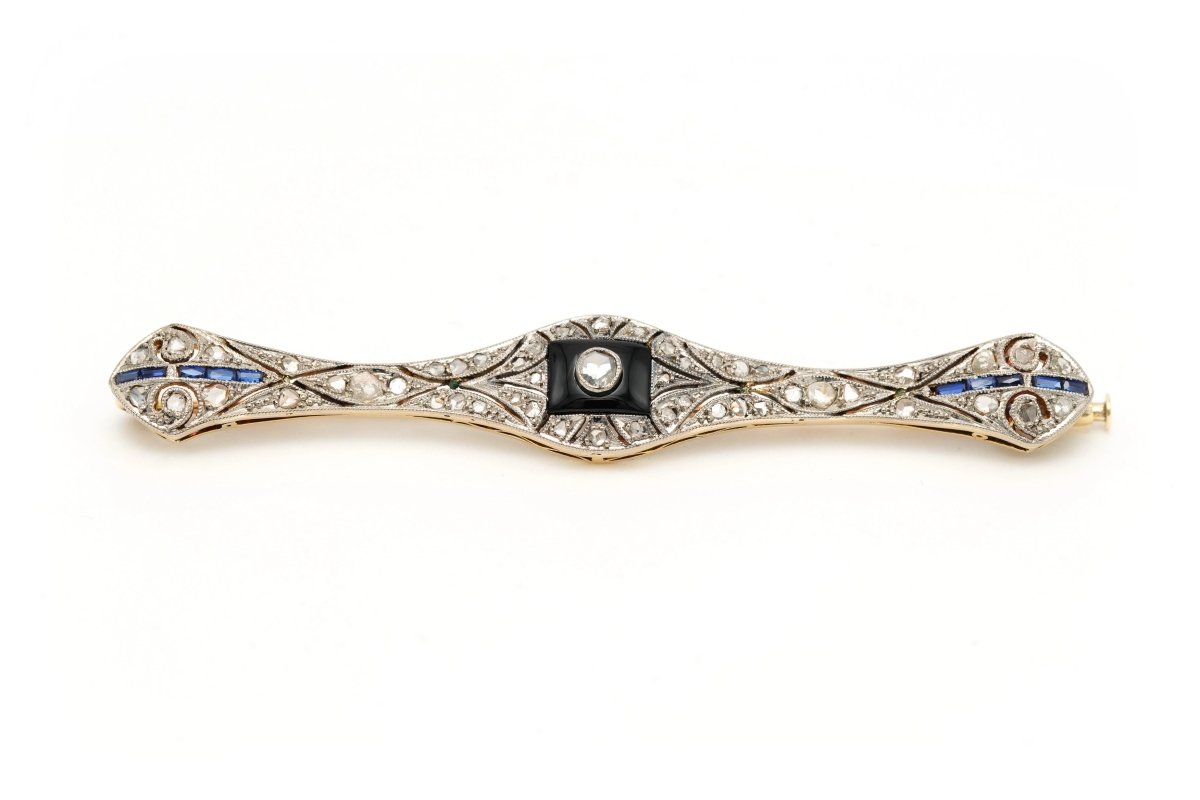 Broche Barrette en or blanc, or jaune, onyx, saphirs et diamants - Castafiore