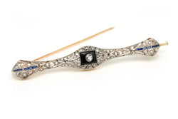 Broche Barrette en or blanc, or jaune, onyx, saphirs et diamants - Castafiore