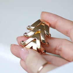 Broche BOUCHERON clip en or rose et rubis - Castafiore