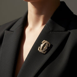 Broche CARTIER Double C en or jaune et diamants - Castafiore