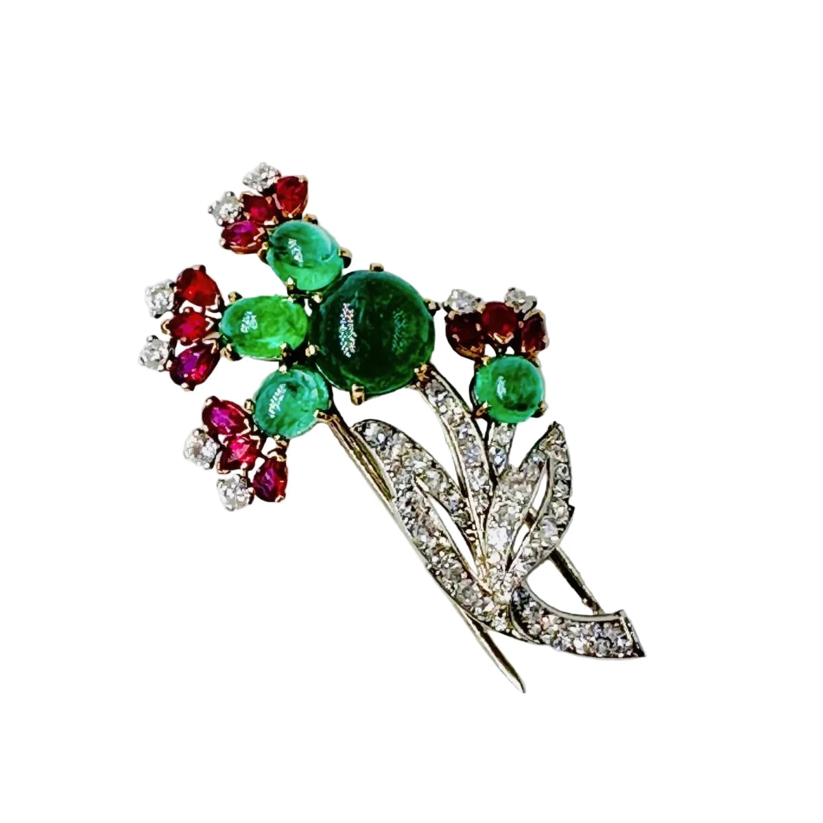 Broche CARTIER 'Fleur" en or blanc, émeraudes, rubis et diamants - Castafiore