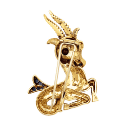 Broche Clip en or jaune, rubis et saphirs - Castafiore