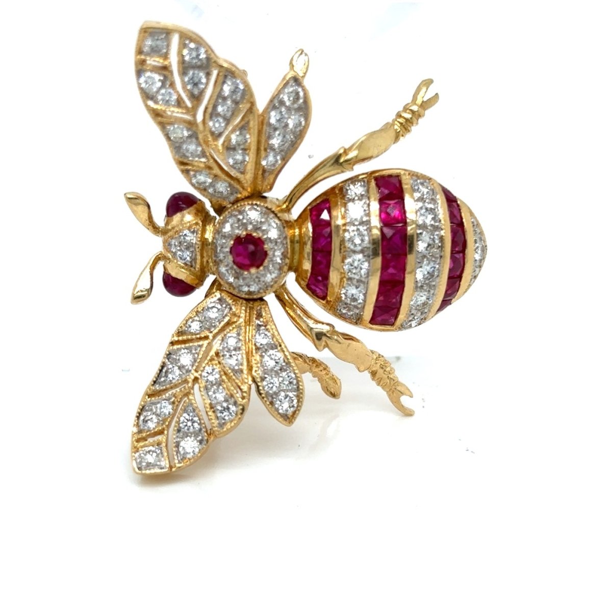 Broche en or jaune, rubis et diamants - Castafiore
