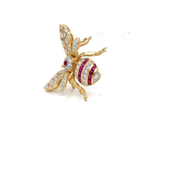 Broche en or jaune, rubis et diamants - Castafiore