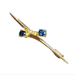 Broche en or jaune, saphirs et diamants - Castafiore