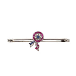 Broche Épingle CARTIER en platine, rubis et saphirs - Castafiore
