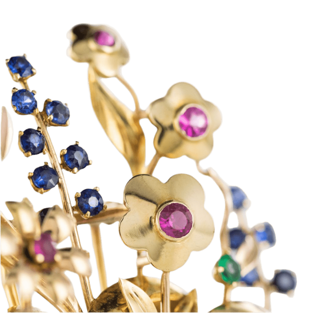 Broche Épingle en or jaune, rubis, saphirs et émeraude - Castafiore