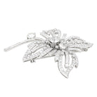 Broche "Fleur" platine, or blanc et diamants - Castafiore