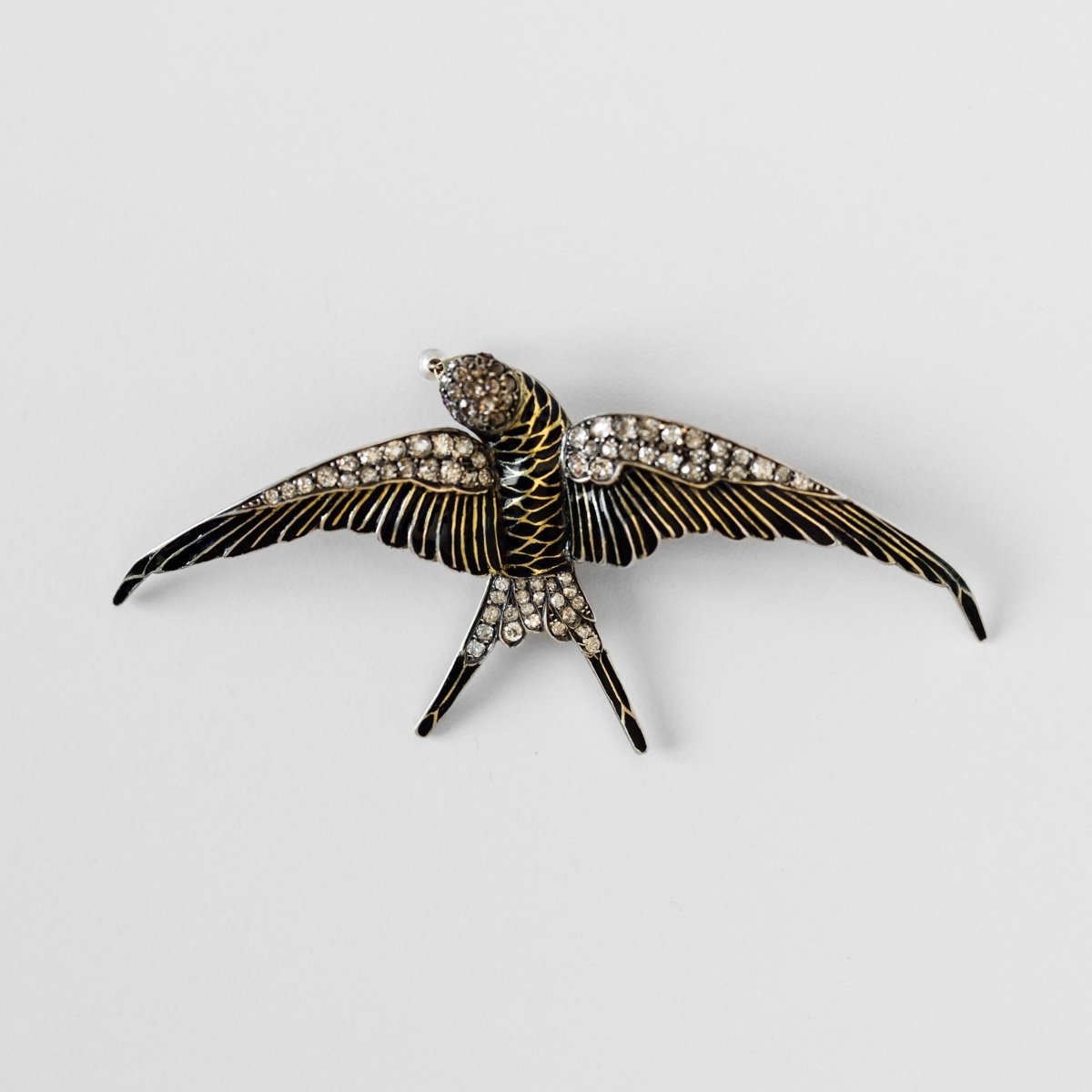 Broche "hirondelle" en or jaune et argent - Castafiore