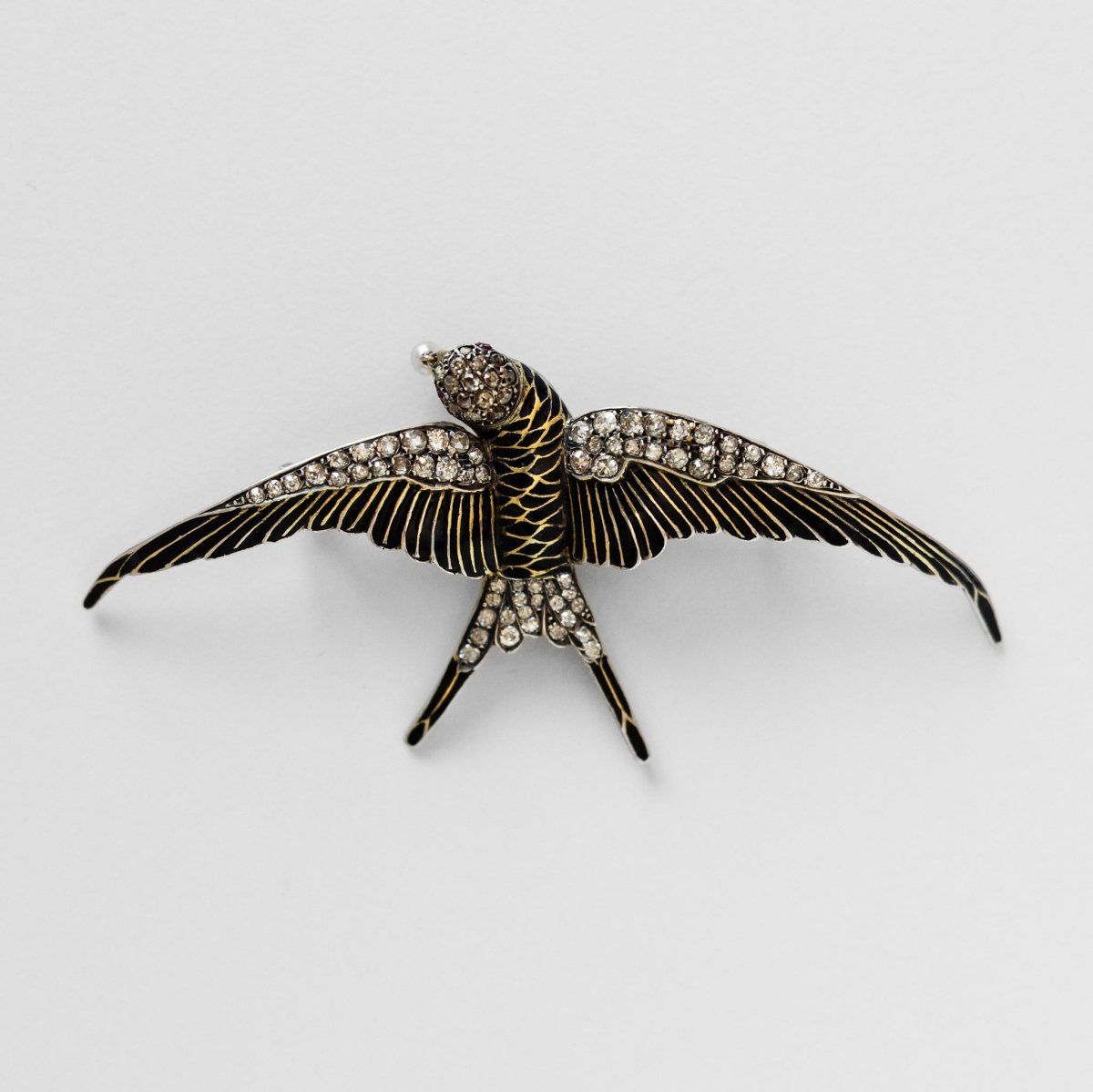 Broche "hirondelle" en or jaune et argent - Castafiore