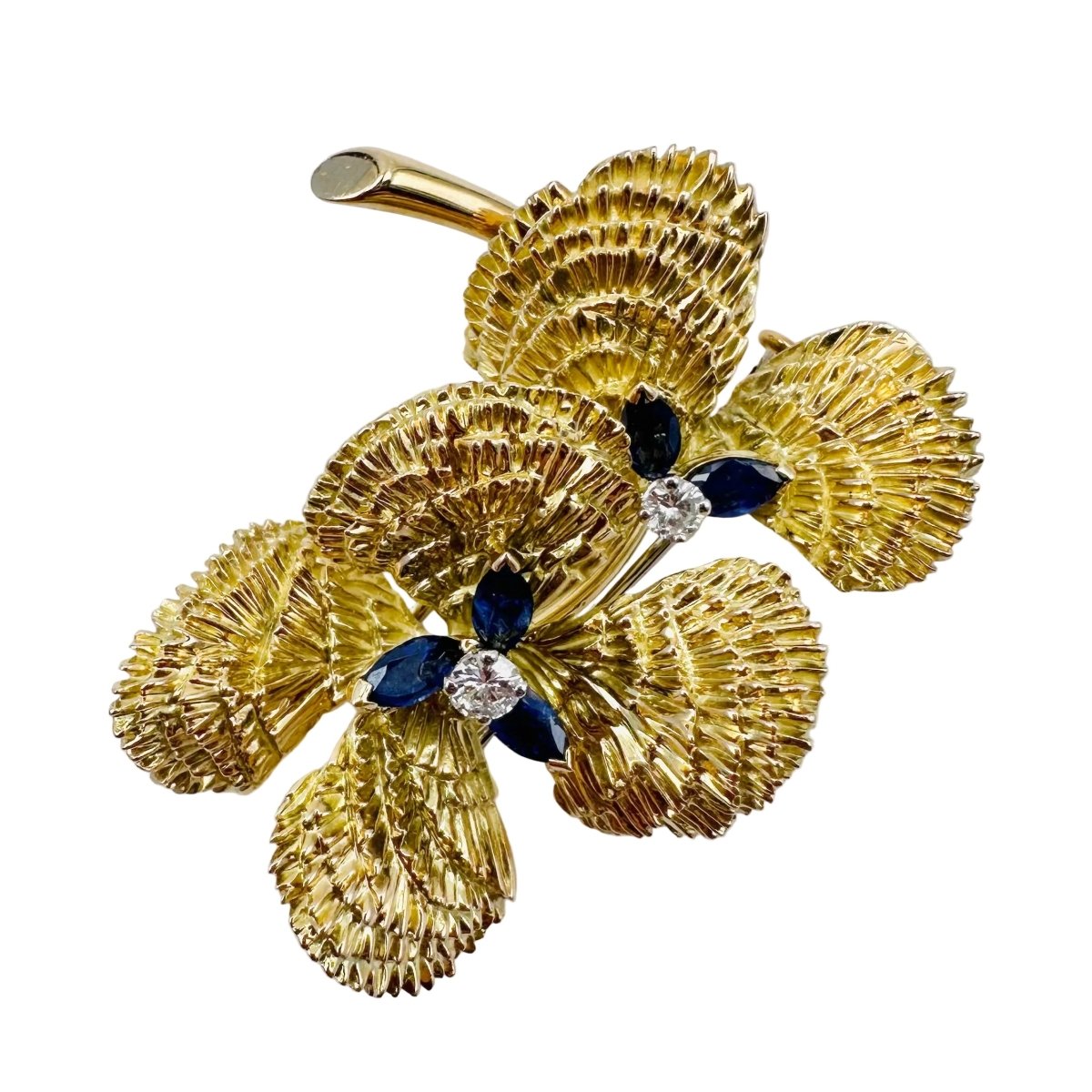 Broche MAUBOUSSIN "Deux fleurs" en or jaune, saphirs et diamant - Castafiore