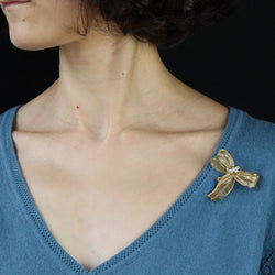 Broche noeud en or jaune et diamants - Castafiore