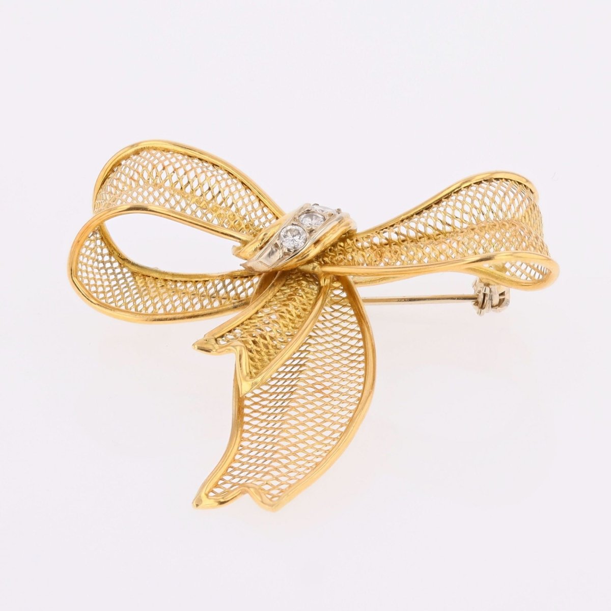 Broche noeud en or jaune et diamants - Castafiore