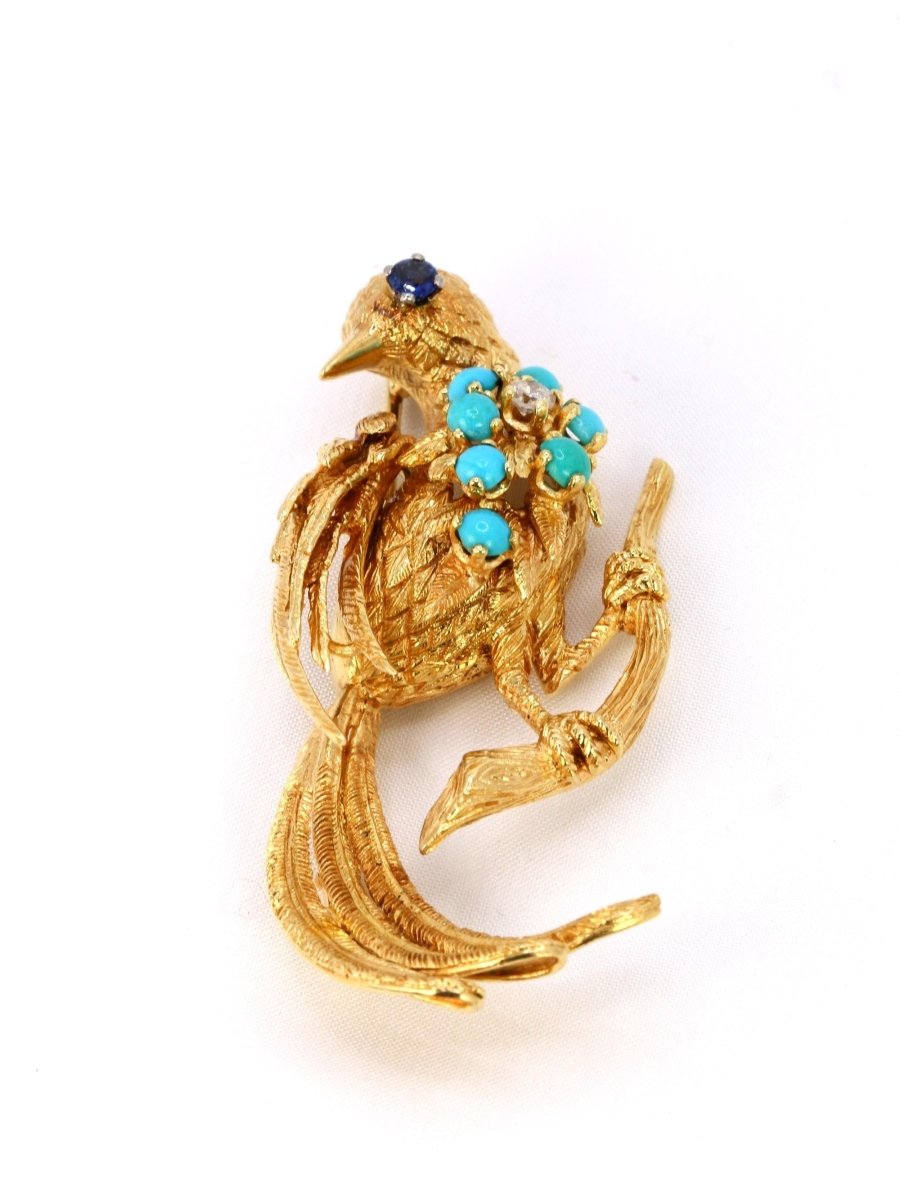 Broche oiseau vintage or jaune saphir turquoise diamant - Castafiore
