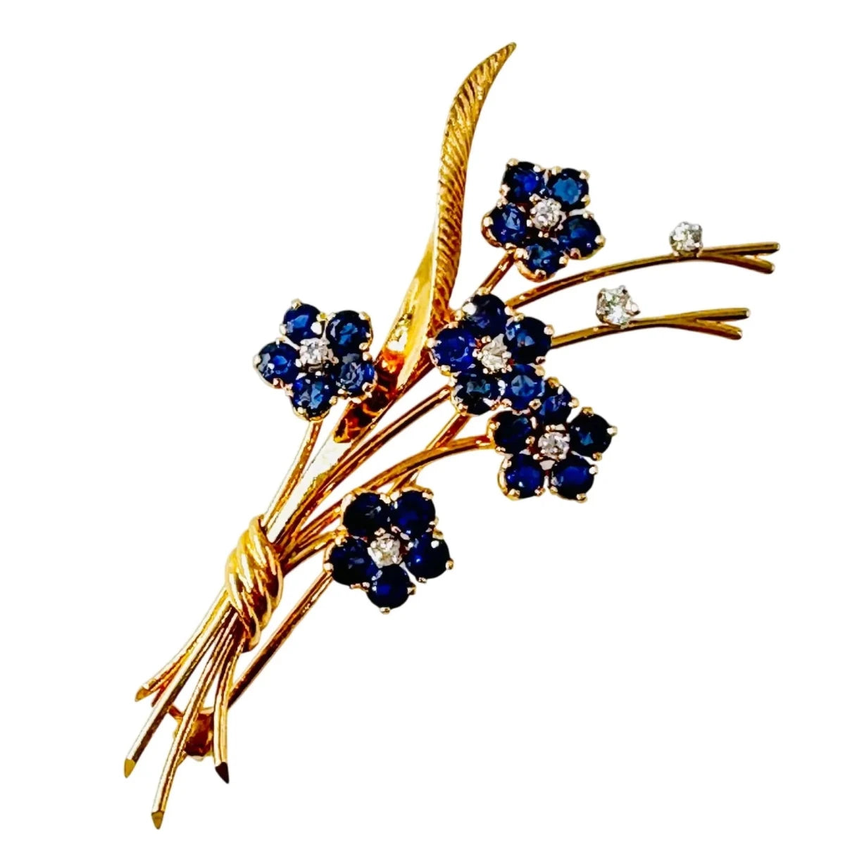 Broche VAN CLEEF & ARPELS "Bouquet Hawaï" en or jaune, platine, saphirs et diamants - Castafiore