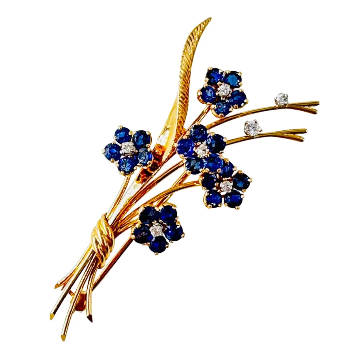 Broche VAN CLEEF & ARPELS "Bouquet Hawaï" en or jaune, platine, saphirs et diamants - Castafiore