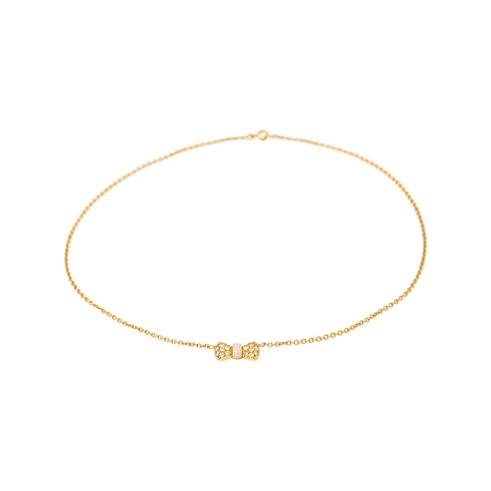Collier Pendentif VAN CLEEF & ARPELS "Noeud" en or jaune, corail et diamants