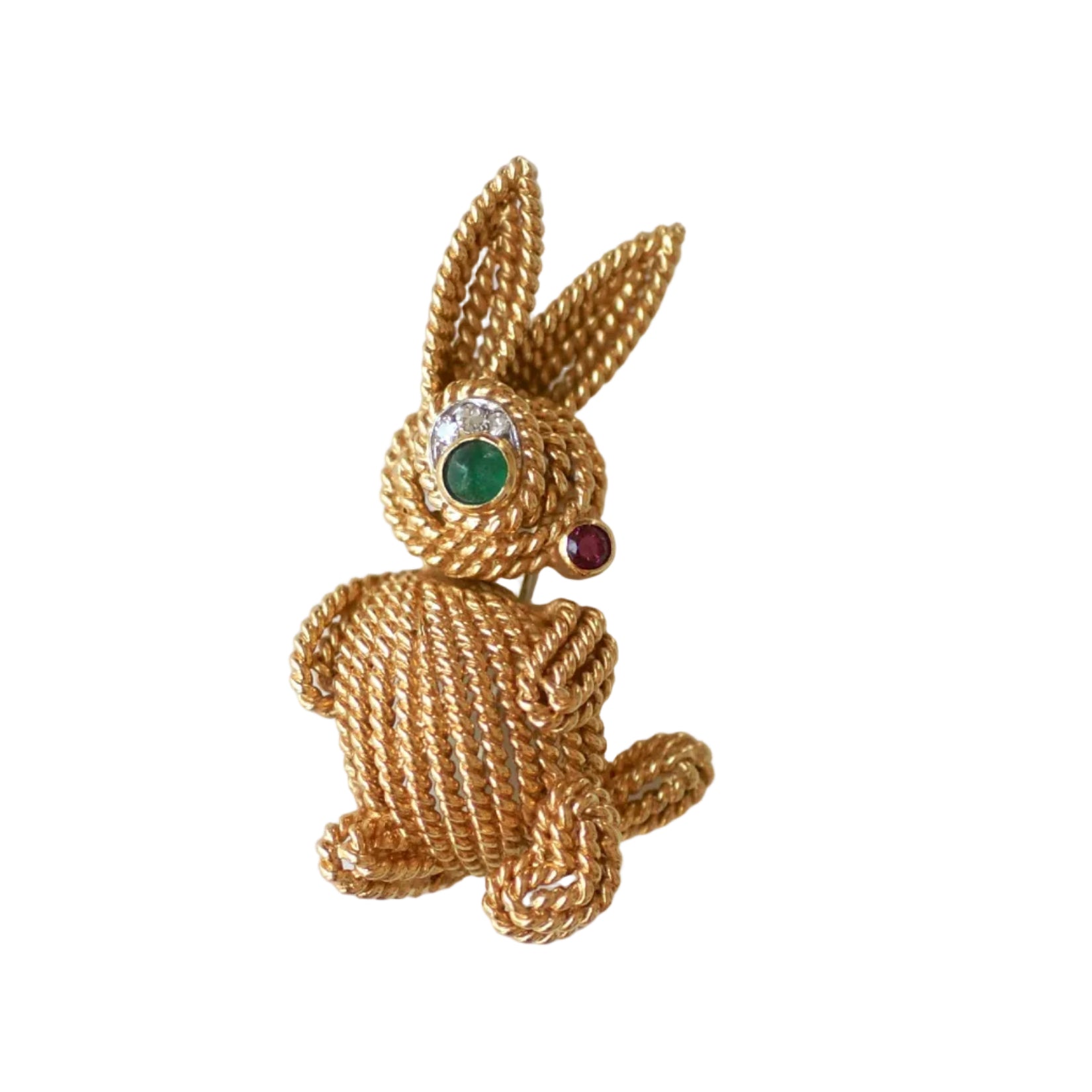 Broche Clip en or blanc, or jaune, émeraude, rubis et diamants
