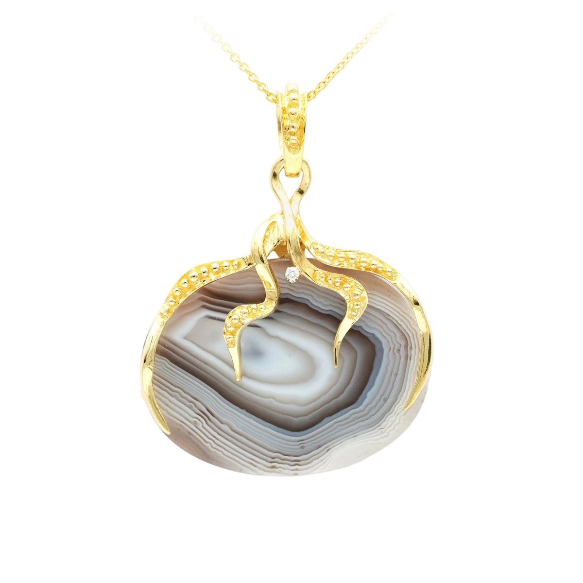 Pendentif en or jaune, agate et diamant