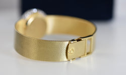 Montre CHOPARD, Réf. 810, or jaune 18 carats et diamants, bracelet intégré or massif, vers 1980.