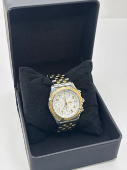 Montre Breitling Chronomat en or et acier