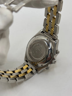 Montre Breitling Chronomat en or et acier