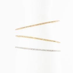Trois bracelets Joncs en or blanc, or jaune, or rose et diamants