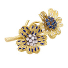 Clip BOUCHERON "Fleurs", or jaune, émaux, diamants et saphirs - Castafiore