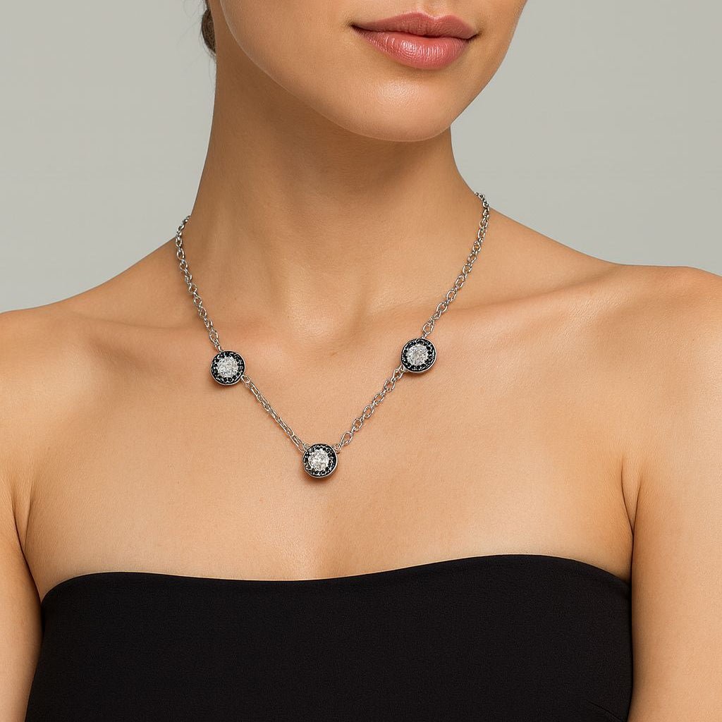 Collier BULGARI en or blanc, onyx et diamants - Castafiore