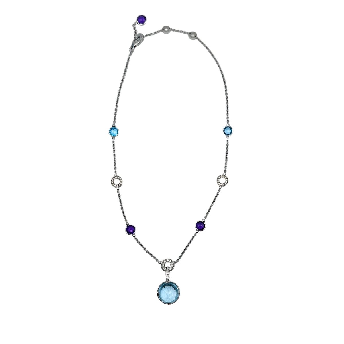 Collier BVLGARI "Parentesi Cocktail" en or blanc, topazes bleues, améthystes et diamants - Castafiore