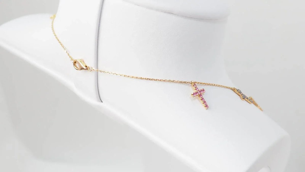 Collier Cartier 11 Croix en or rose, diamants et saphirs de couleurs - Castafiore