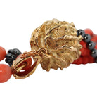 Collier CHAUMET "Pompon" en or jaune, corail et hématite - Castafiore