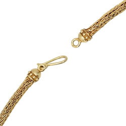 Necklace in braided gold with ram's head motifs diamonds and rubies