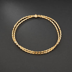 Collier en or jaune 18K à deux rangs, signé MELLERIO. - Castafiore