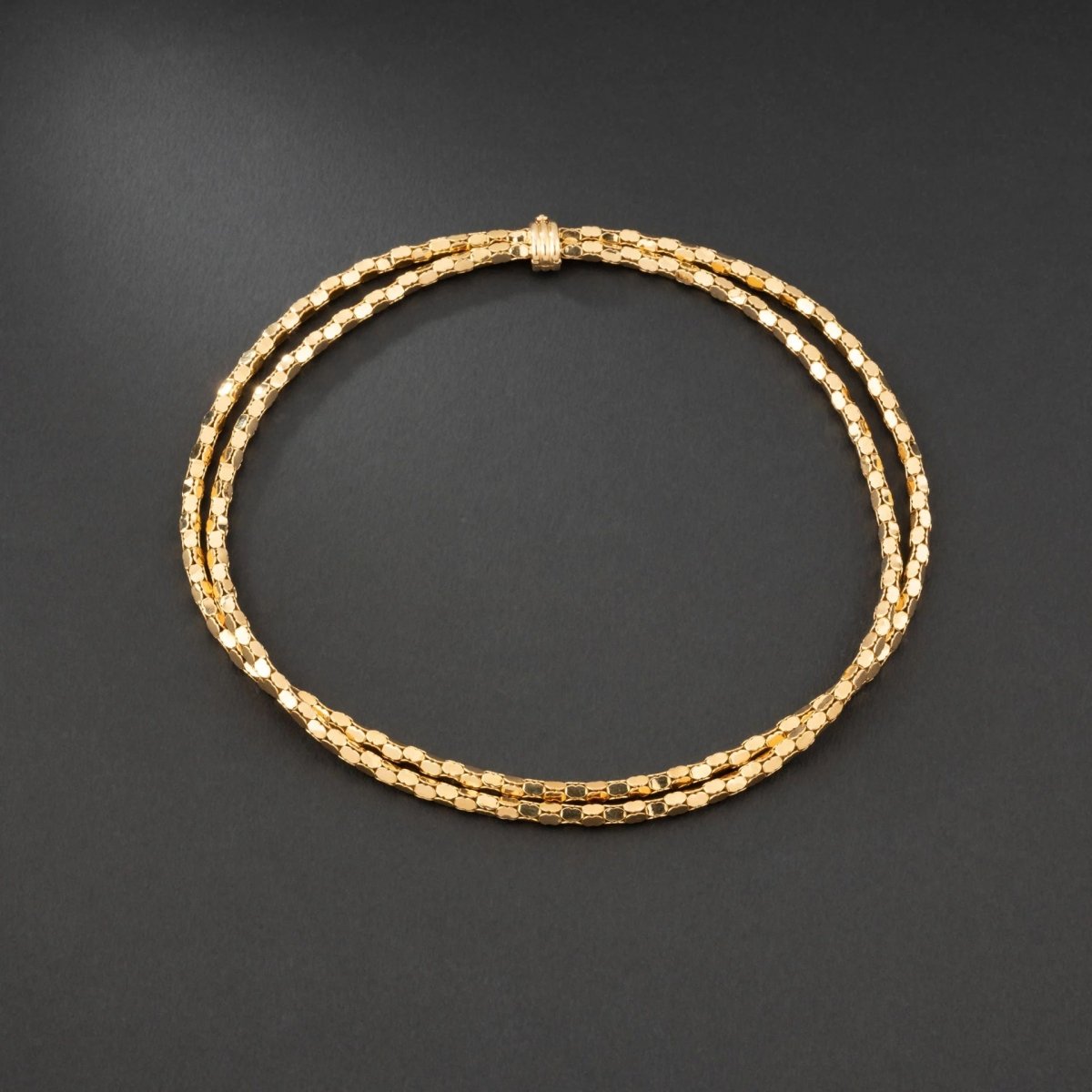 Collier en or jaune 18K à deux rangs, signé MELLERIO. - Castafiore
