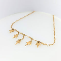 Collier en or jaune à pampilles étoiles - Castafiore