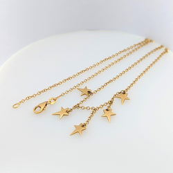 Collier en or jaune à pampilles étoiles - Castafiore