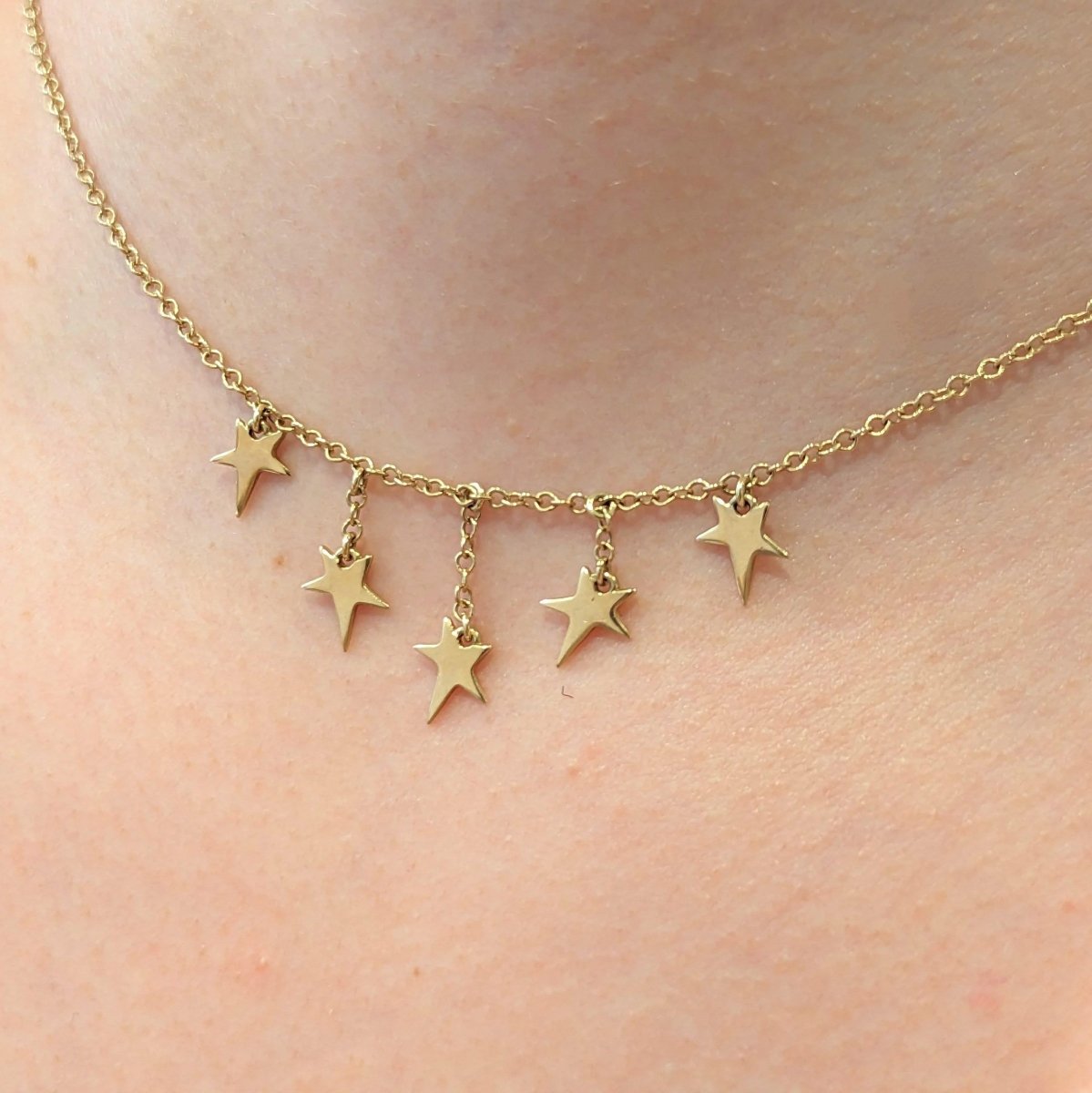 Collier en or jaune à pampilles étoiles - Castafiore