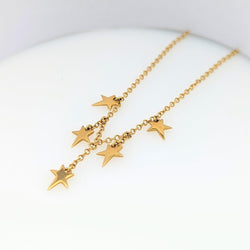 Collier en or jaune à pampilles étoiles - Castafiore