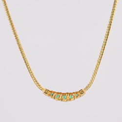 Collier maille gourmette en or jaune et émeraude - Castafiore