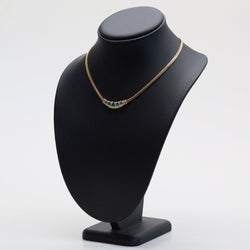 Collier maille gourmette en or jaune et émeraude - Castafiore