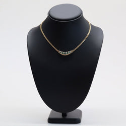 Collier maille gourmette en or jaune et émeraude - Castafiore