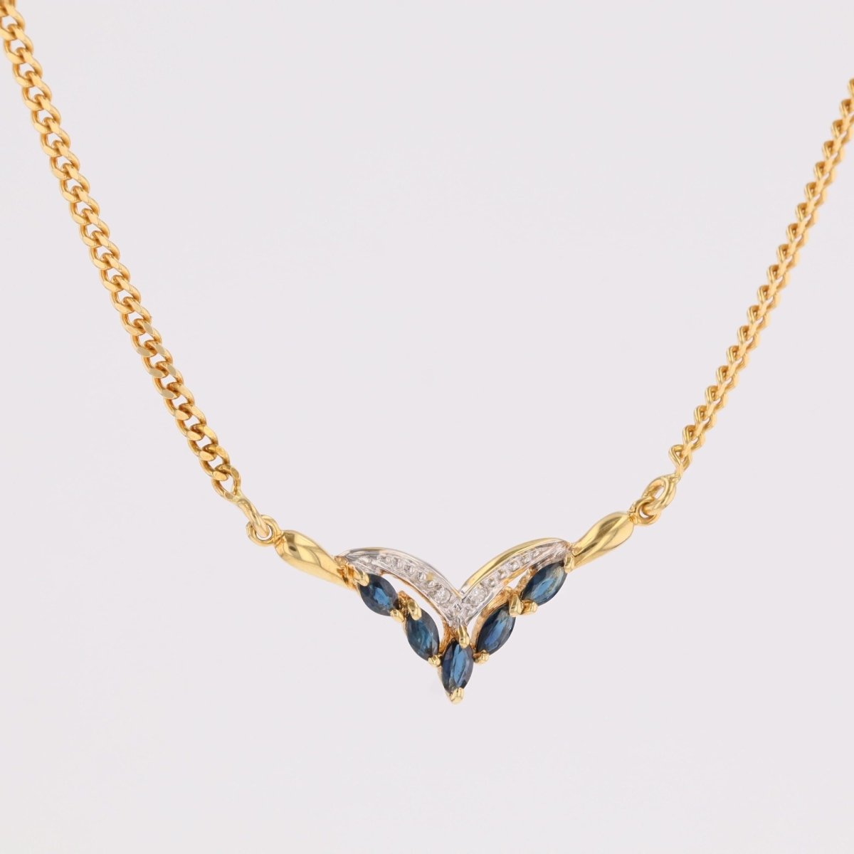 Collier maille gourmette en or jaune et saphirs navette diamants - Castafiore