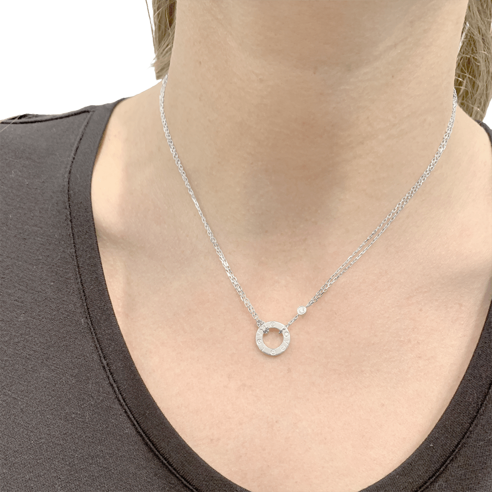 Collier Pendentif CARTIER "Love" en or blanc et diamants - Castafiore