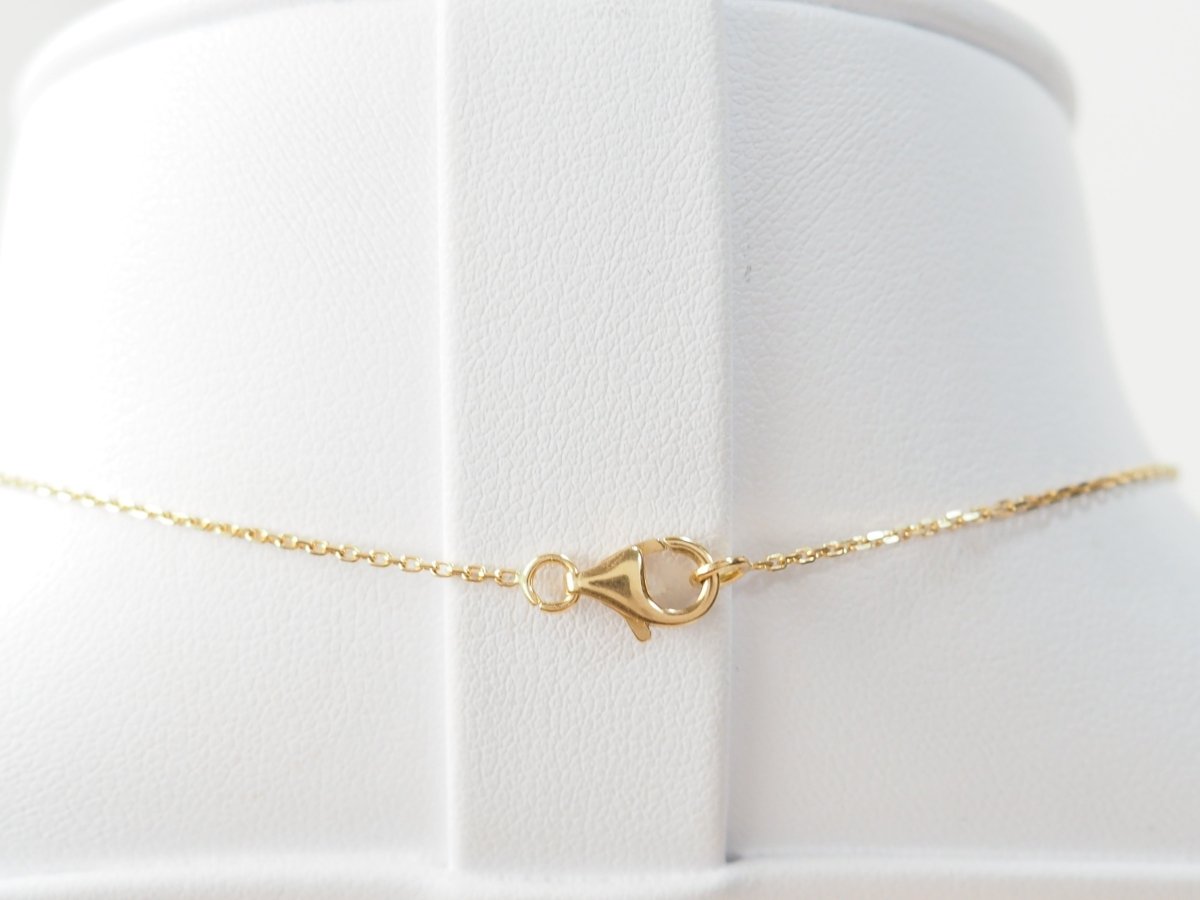 Collier pendentif marguerite en or jaune et grenats - Castafiore