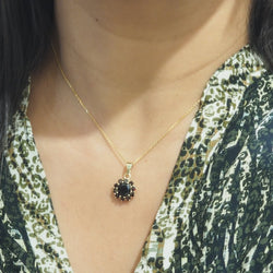 Collier pendentif marguerite en or jaune et grenats - Castafiore