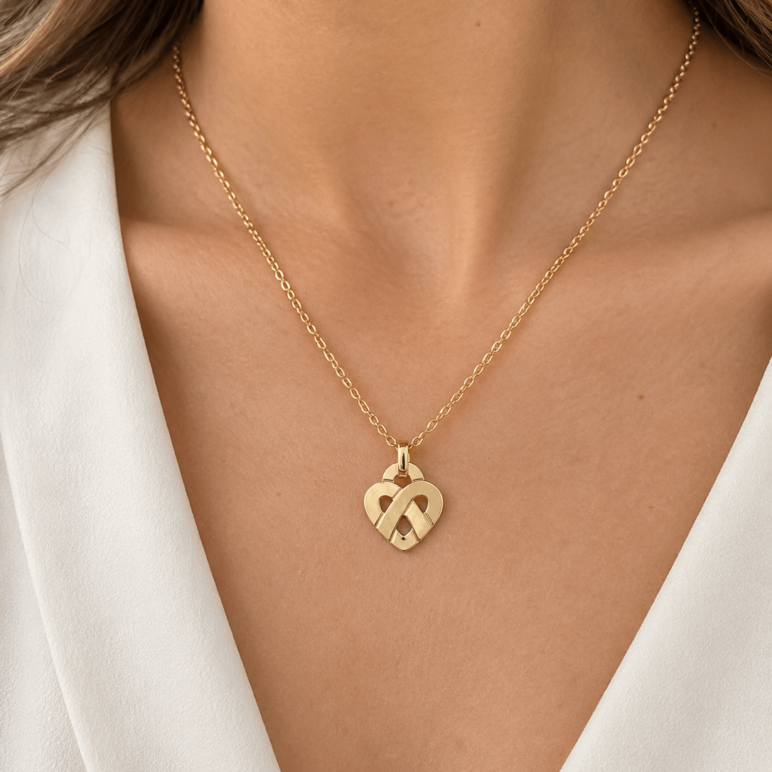 Collier Pendentif POIRAY "Entrelacé" PM en or jaune - Castafiore